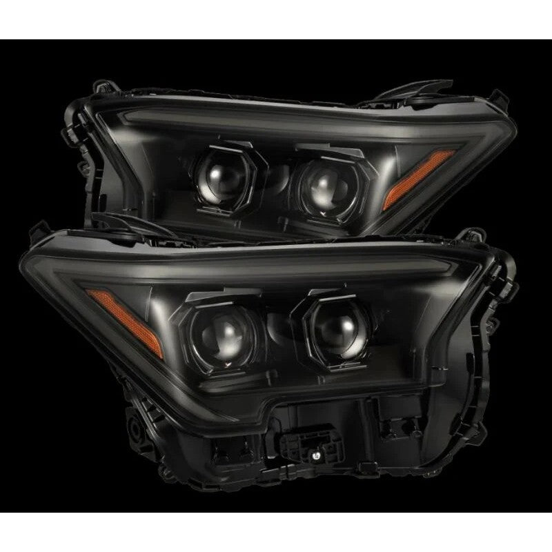 AlphaRex LUXX-Series projector headlights for the 2024 Toyota Tacoma featuring high-performance lenses and black housings
