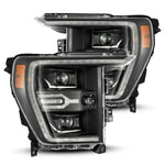 AlphaRex Luxx-Series black projector headlights for 2021-2023 Ford F-150 with LED signature lighting accents.