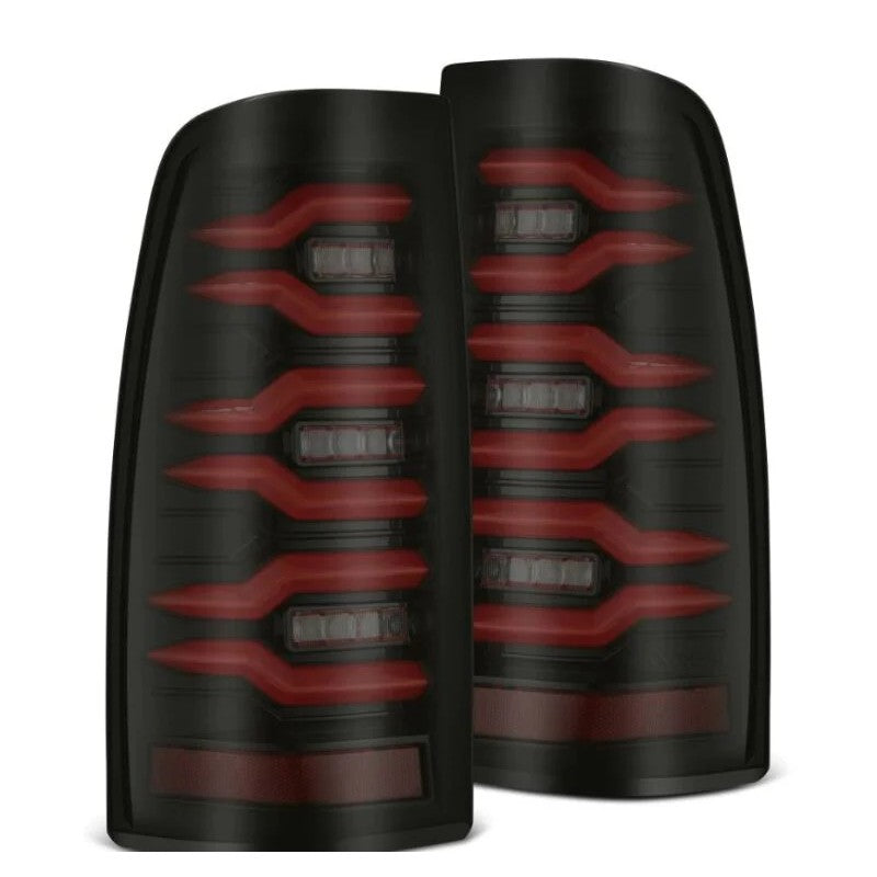 Pair of AlphaRex LUXX-Series LED tail lights with black housings and red lenses for 1999-2006 Silverado and Sierra.