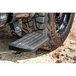 Black AMP Research BedStep2 retractable aluminum side step for Ford F-150 truck beds.