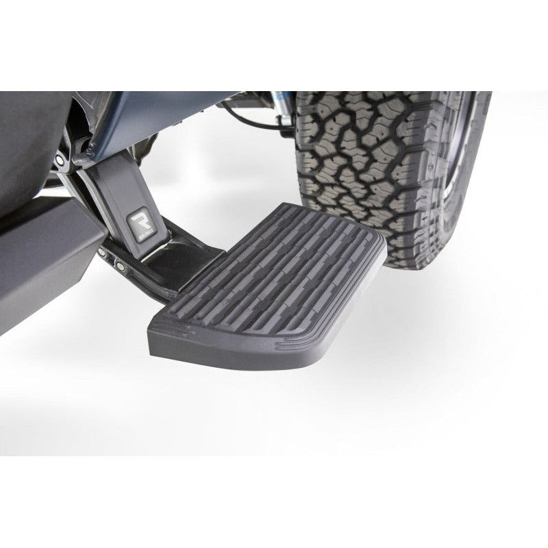 Black AMP Research BedStep2 retractable side-mounted truck bed step for 2019-2024 Ram 1500