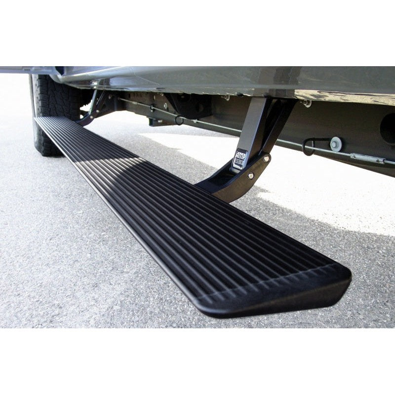 AMP Research PowerStep electric running board in black finish with integrated LED lighting for Chevy and GMC trucks.