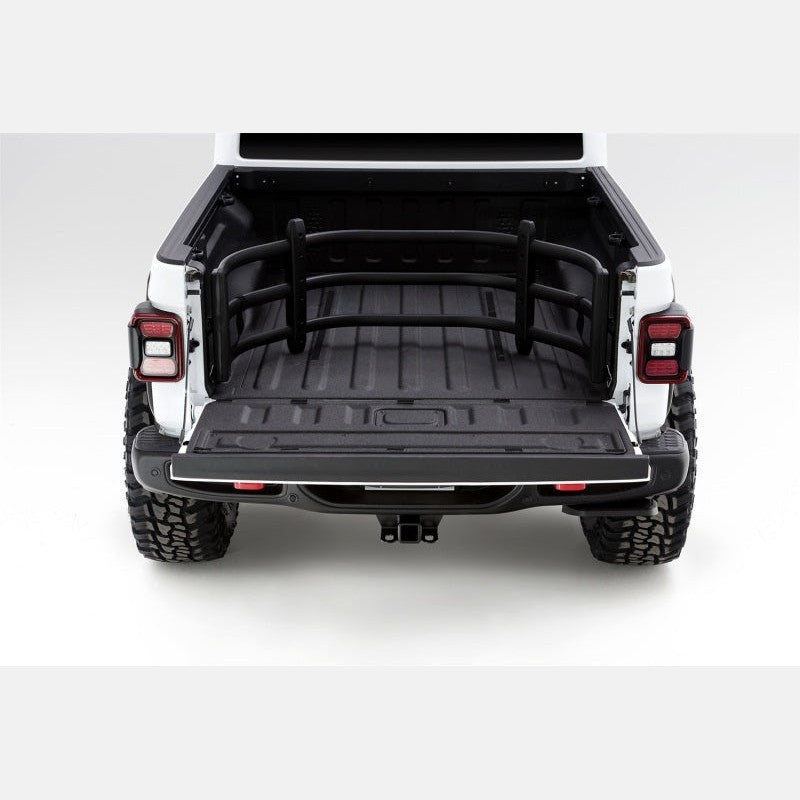 Black AMP Research BedXtender HD Sport aluminum bed extender installed on a Jeep Gladiator with the tailgate open