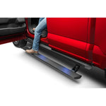 Black AMP Research PowerStep XL electric running board with integrated rocker rail and LED illumination.