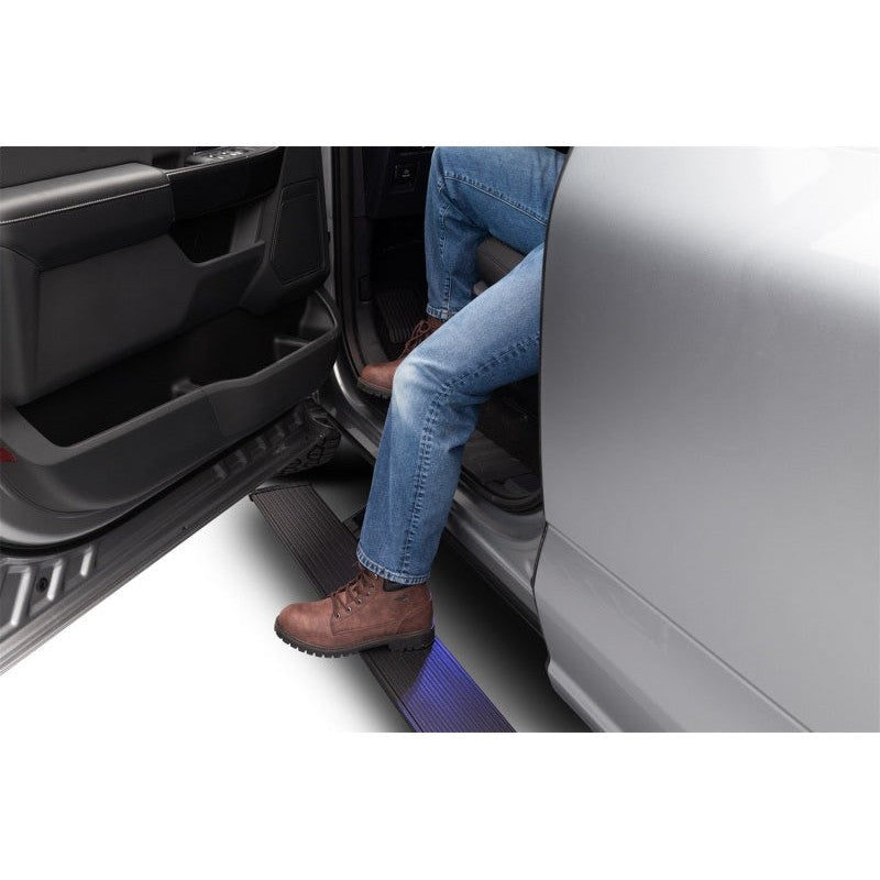 Black AMP Research PowerStep automatic electric running boards with integrated LED lights for 2015-2020 Ford F-150.