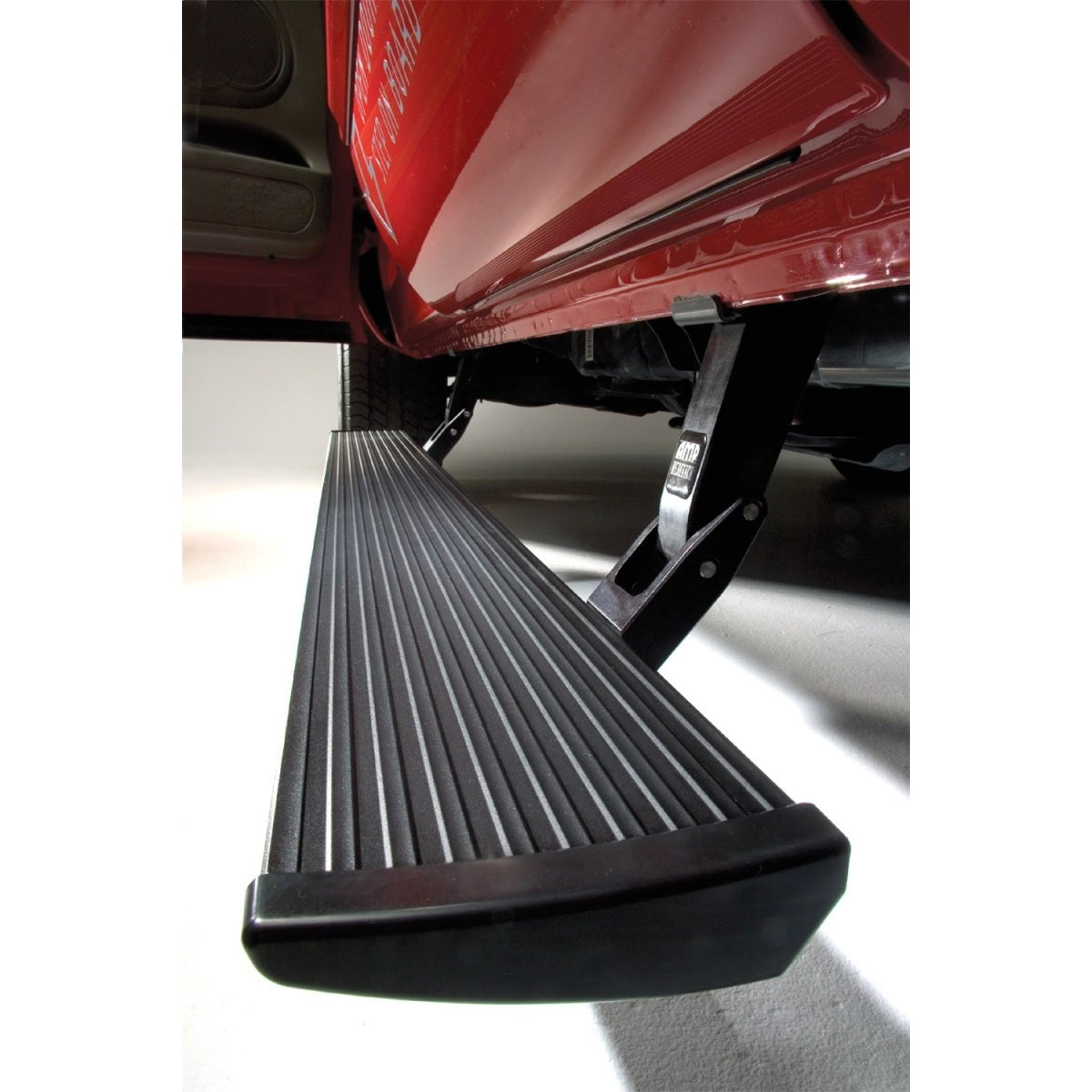 Black AMP Research PowerStep electric running boards with Plug N Play harness for 2017-2019 Chevy and GMC HD trucks