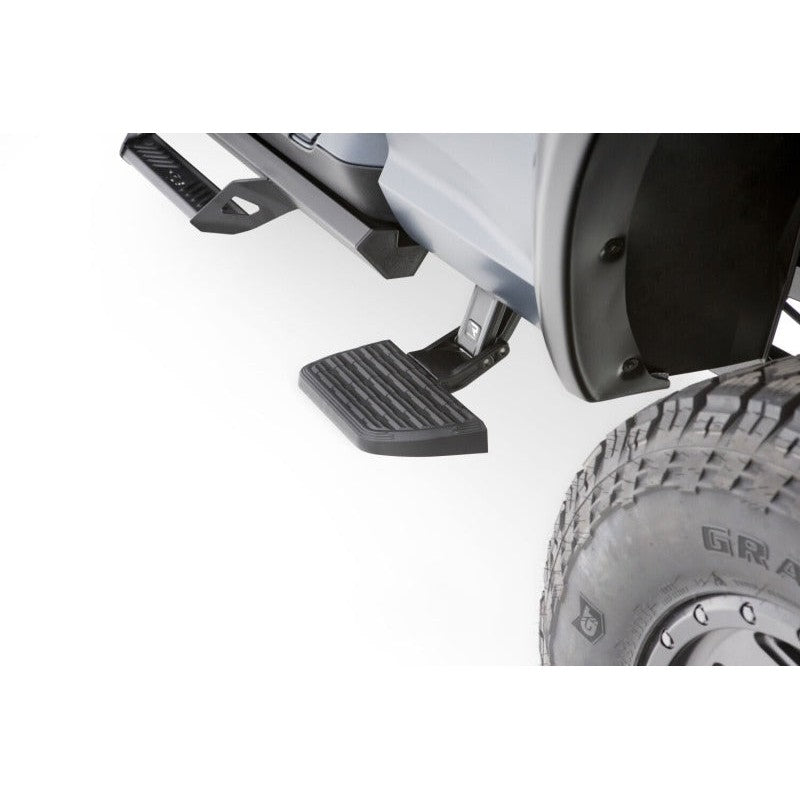 Black AMP Research BedStep2 retractable side-mounted truck bed step for 2019-2025 Ram 2500 and 3500.