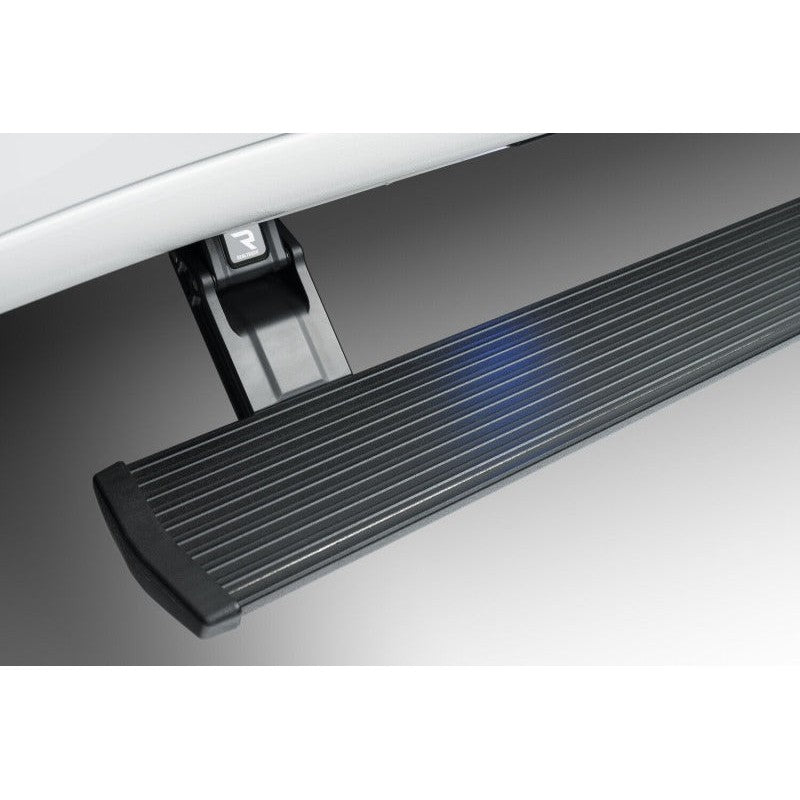 Black AMP Research PowerStep XL electric running board with integrated LED lights and mounting hardware