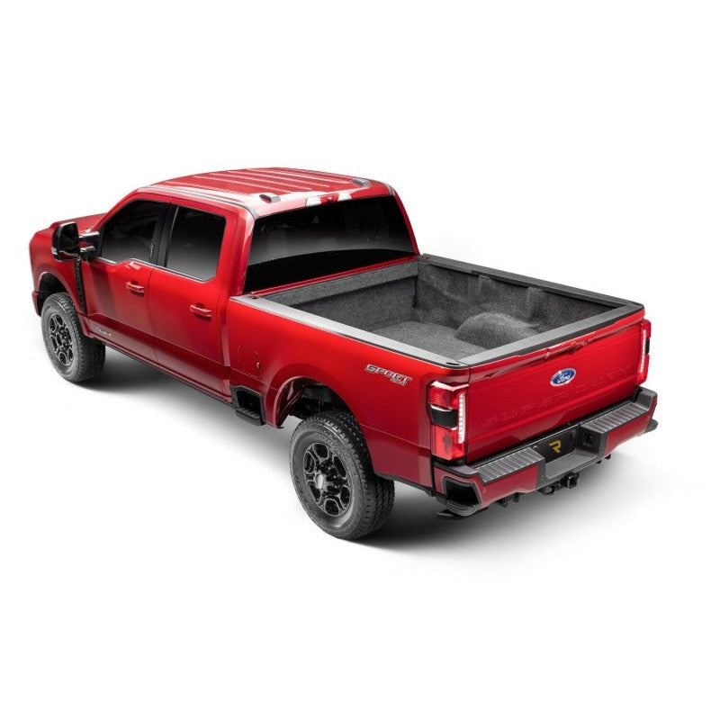 Black AMP Research PowerStep Plug N Play electric running boards and mounting hardware for 2022-2026 Ford Super Duty