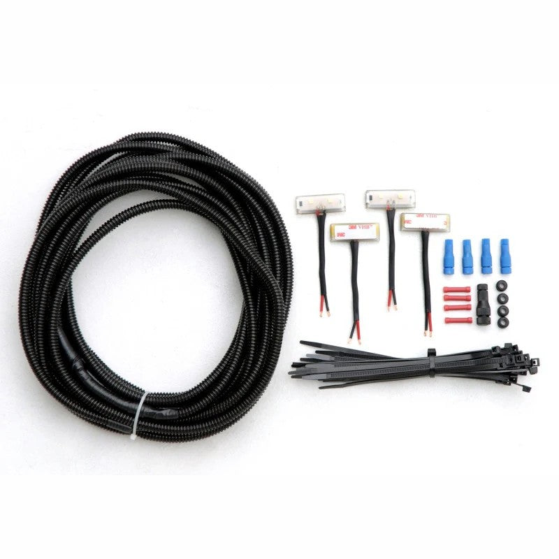 AMP Research PowerStep LED Light Kit including four LED lamps and wiring harness for new style controllers.