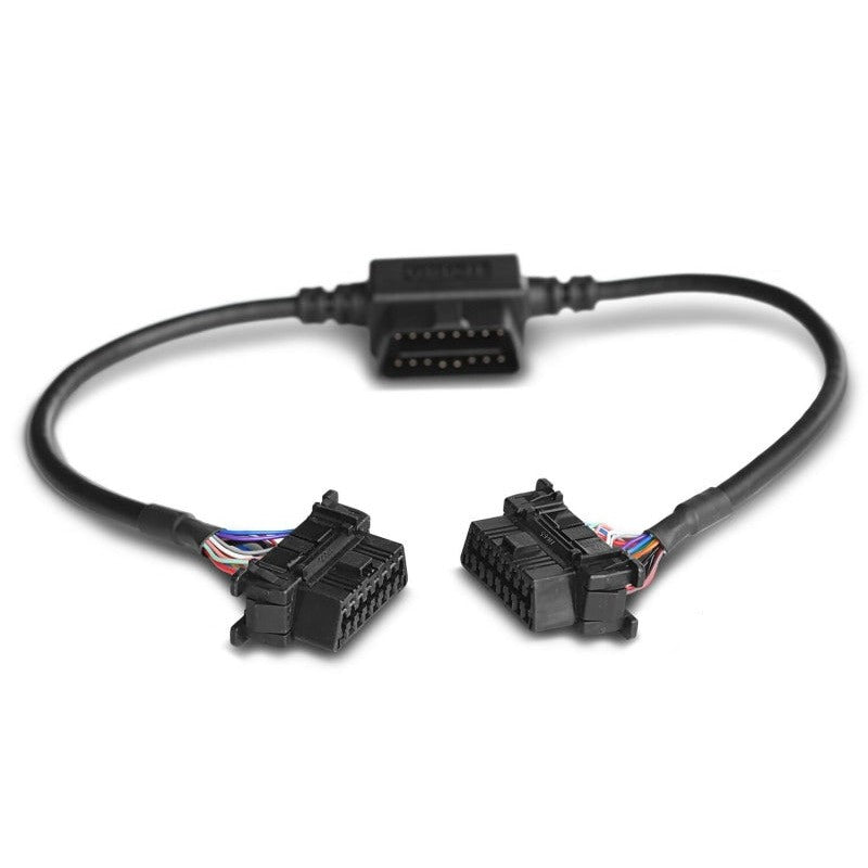 AMP Research PowerStep black pass-thru harness with clip-in OBD-II connector and vehicle wiring.