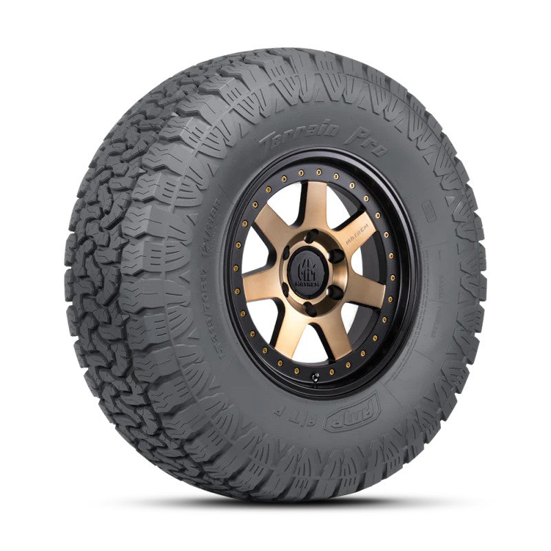 AMP Terrain Pro A/T all-terrain tire featuring aggressive tread blocks and Twin Peaks sidewall design.