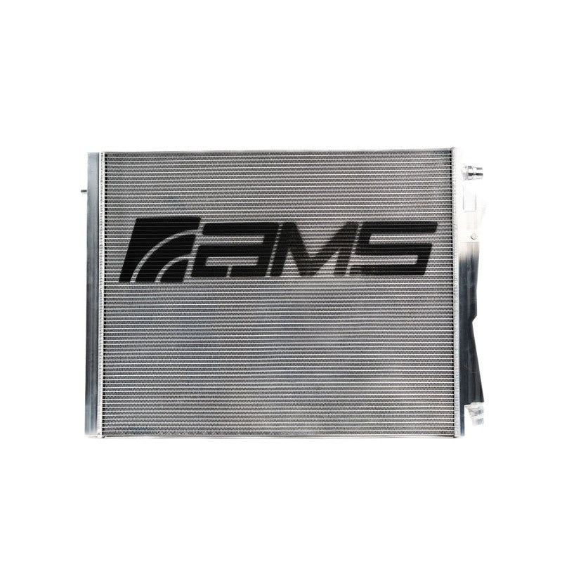 AMS Performance heat exchanger for BMW G8X M2/M3/M4 S58 engine, featuring black logo on aluminum core.