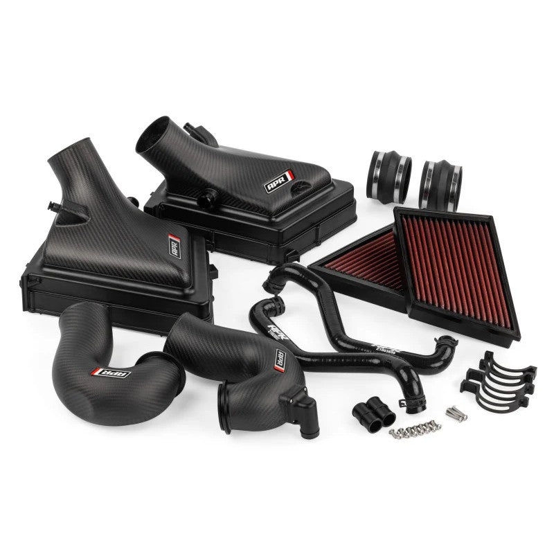 Matte carbon fiber intake housing with twin turbocharger inlet pipes and mounting hardware for Porsche 911 992.