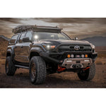 ARB Zenith Winch Bar in textured black with red recovery points installed on a 2024 Toyota Tacoma.