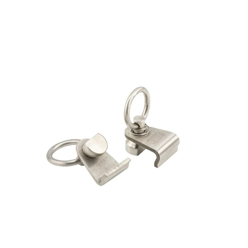 Pair of stainless steel quick-release tie-down eyelets for the ARB BASE Rack dovetail mounting system.