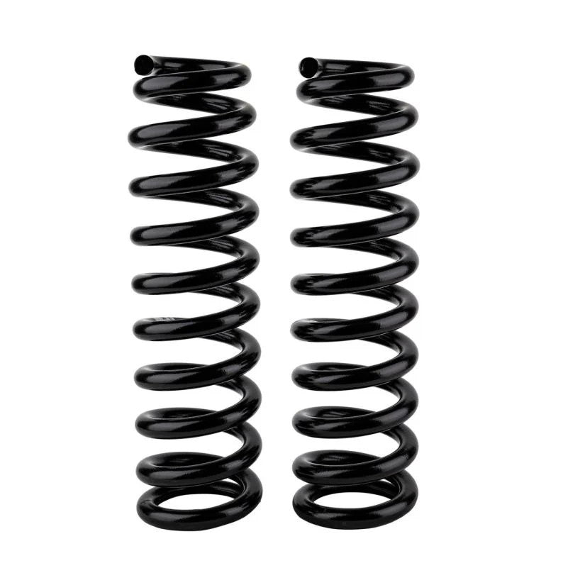 A pair of black powder-coated Old Man Emu front heavy duty coil springs for Toyota 4Runner and Tacoma.