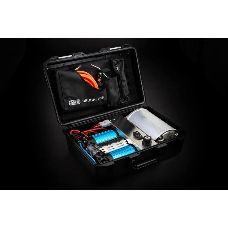 ARB portable 12V twin brushless air compressor kit in a durable carry case with 20ft air hose and inflation accessories.