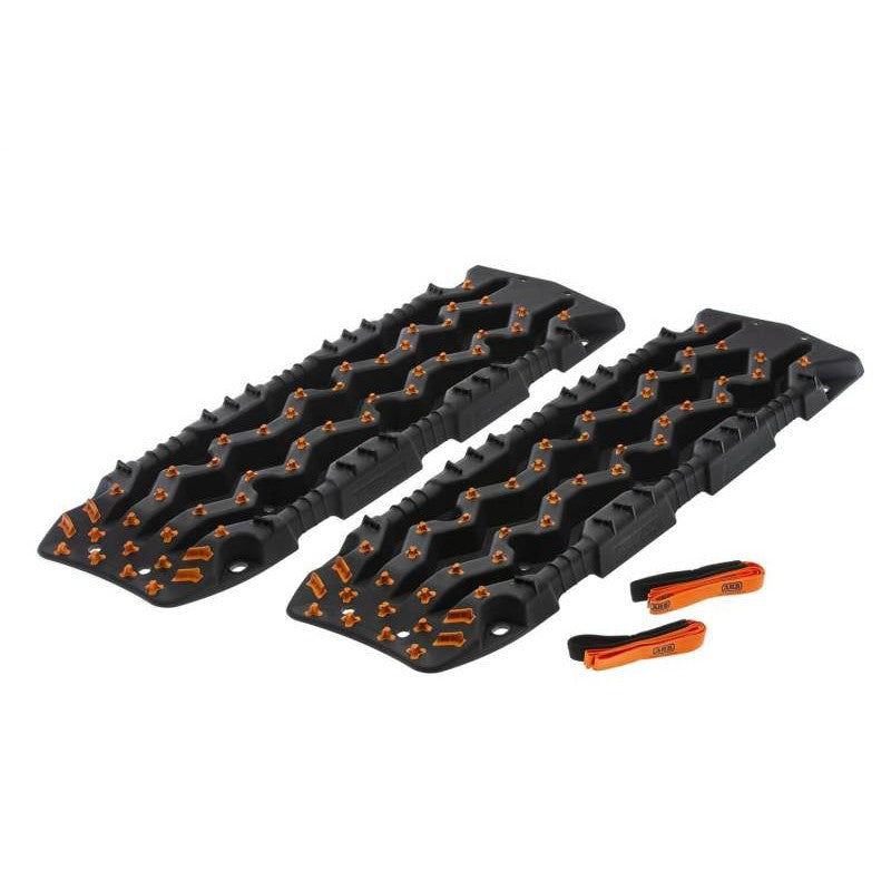 ARB TRED Pro recovery boards in stealth black with bright orange traction nodules.
