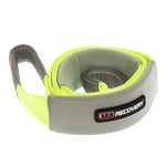 High-visibility orange ARB tree trunk protector strap with reinforced eyes and protective sleeves for vehicle recovery.