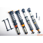 AST 5100 Series Clubracing coilover kit with 1-way adjustable dampers, springs, camber plates, and droplinks.