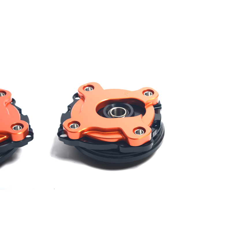 AST adjustable top mount camber plates for BMW M2, M3, and M4 G-series chassis with OEM dampers.