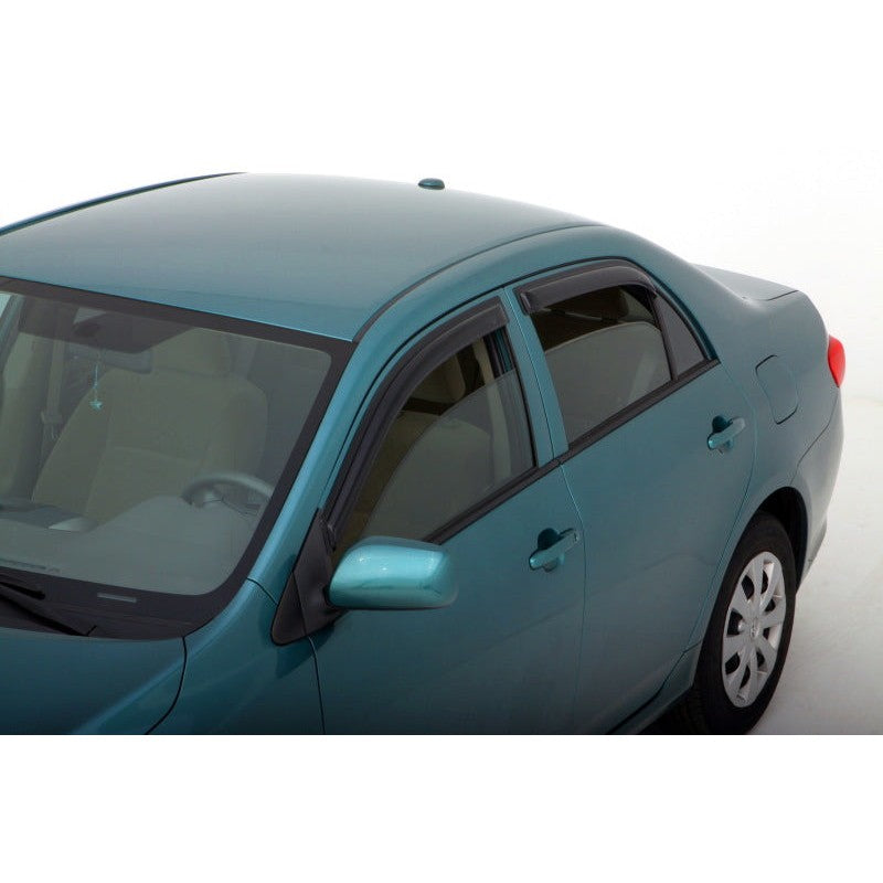 Four-piece set of smoke finish AVS Ventvisor outside mount window deflectors for 2009-2013 Toyota Corolla.