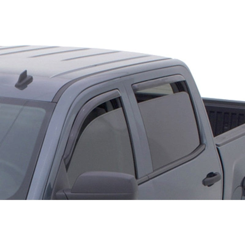 Four piece set of AVS In-Channel Ventvisor side window deflectors in dark smoke finish for Chevy and GMC trucks.