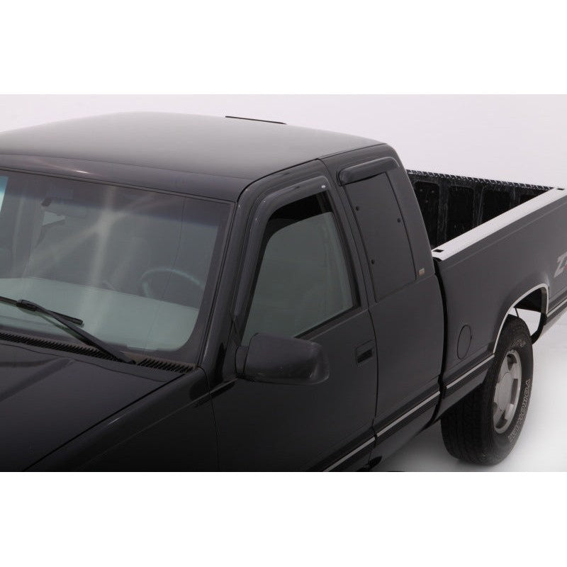 Four smoke-tinted AVS Ventvisor outside mount window deflectors for 1988-2000 Chevy and GMC C/K Extended Cab trucks.