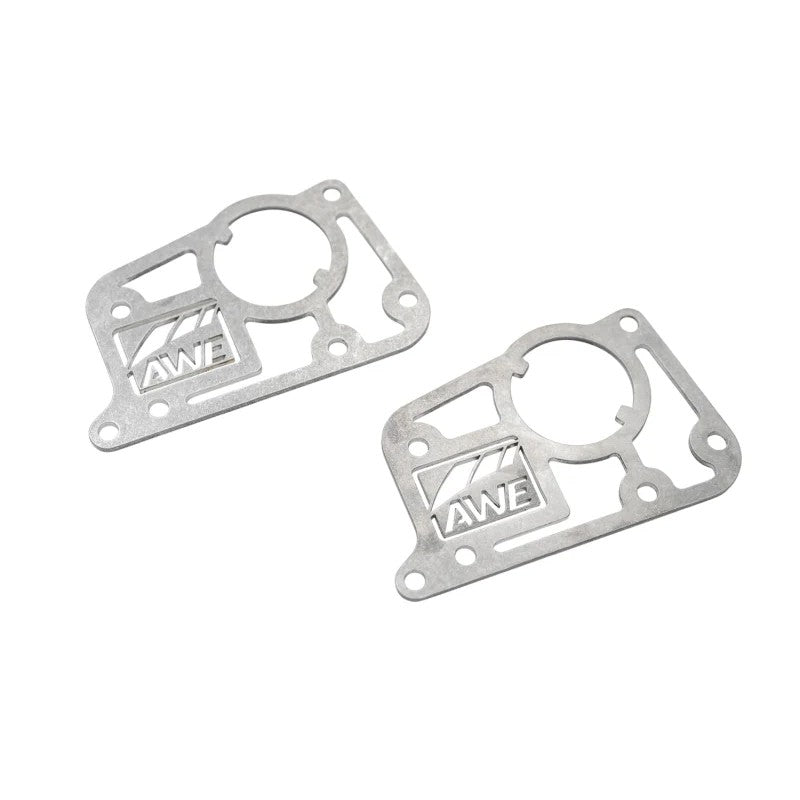 A pair of AWE Tuning T304 stainless steel AFM valve simulator plates for 2016-2024 Chevrolet Camaro SS.