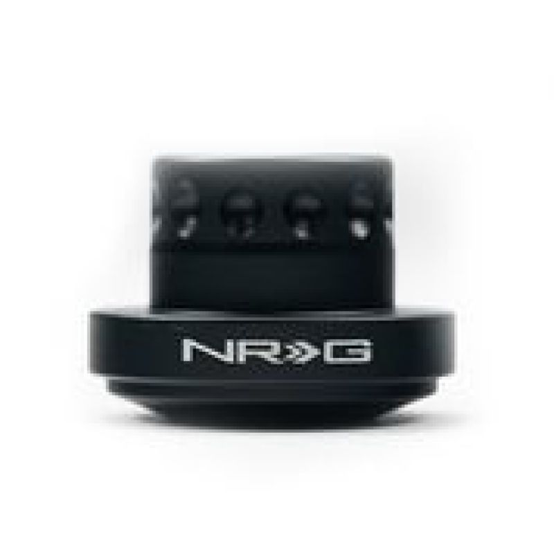 Matte black NRG Innovations short steering wheel hub adapter with 6-bolt pattern for BMW E36 and E39 chassis.