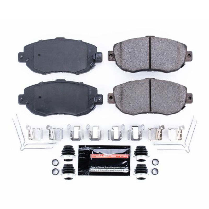 Power Stop Z23 Evolution Sport front carbon-fiber ceramic brake pads with stainless steel hardware and lubricant.