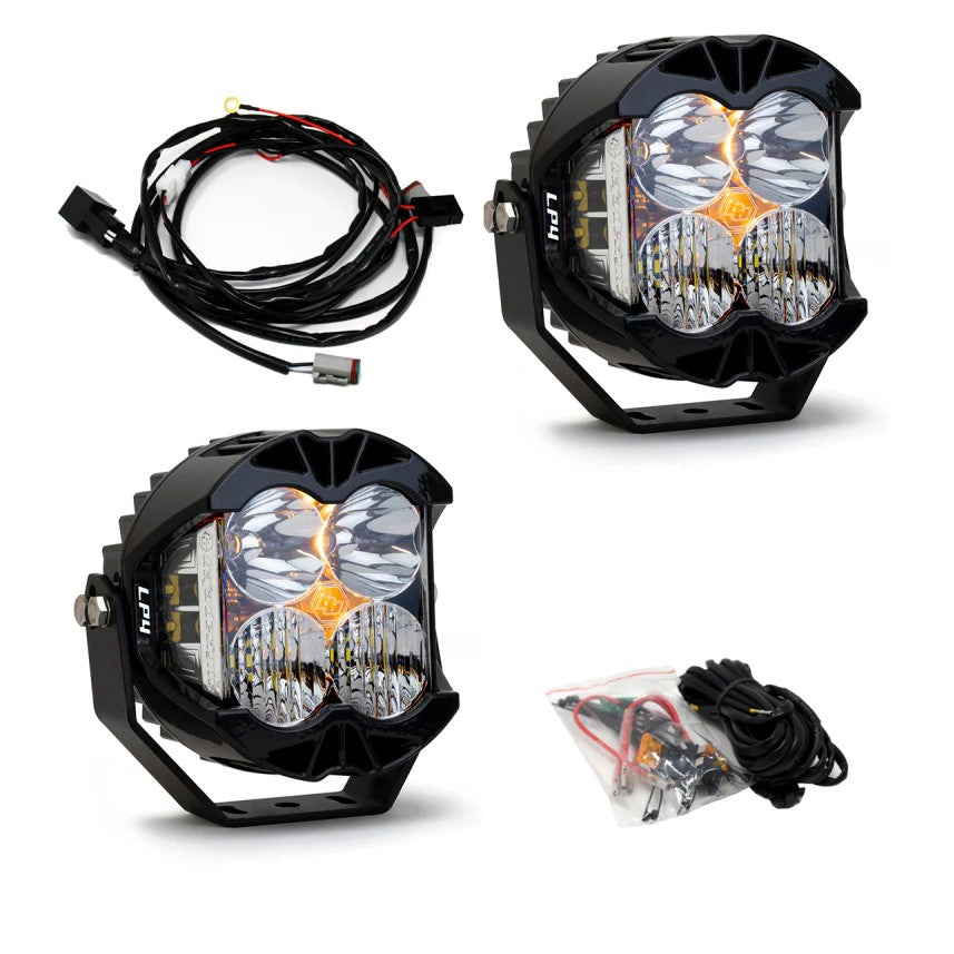 Pair of Baja Designs LP4 Pro LED pods with clear lenses, black finned housings, and integrated peripheral lighting.