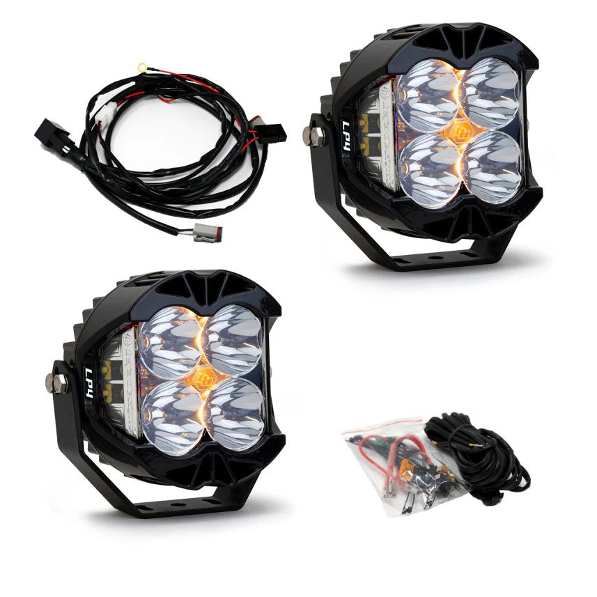Pair of circular Baja Designs LP4 Pro LED lights with clear lenses and integrated cooling fins.
