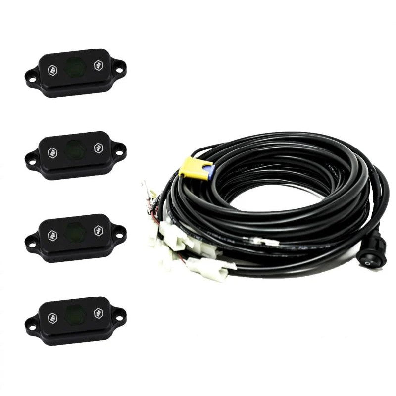 Baja Designs green LED rock light pod with mounting hardware and wiring.