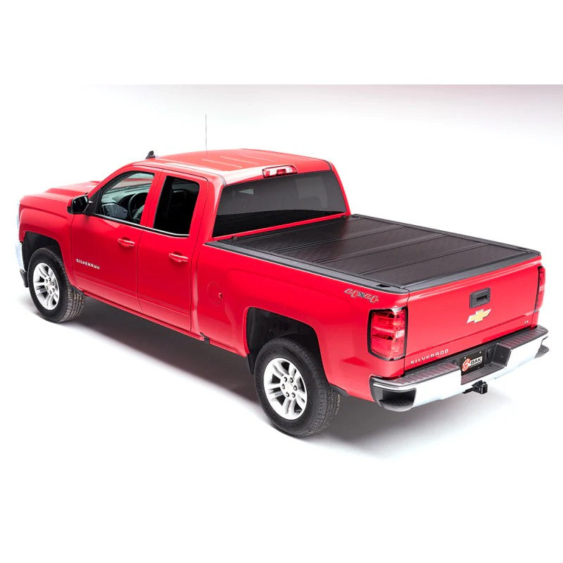 BAK BAKFlip F1 fiberglass reinforced polymer hard folding tonneau cover installed on a Chevrolet Avalanche.