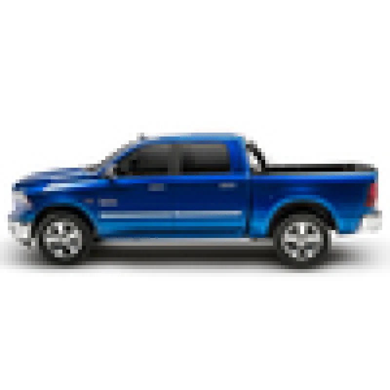 BAK BAKFlip G2 hard folding truck bed cover with black aluminum panels partially folded on a 5 foot 7 inch truck bed.
