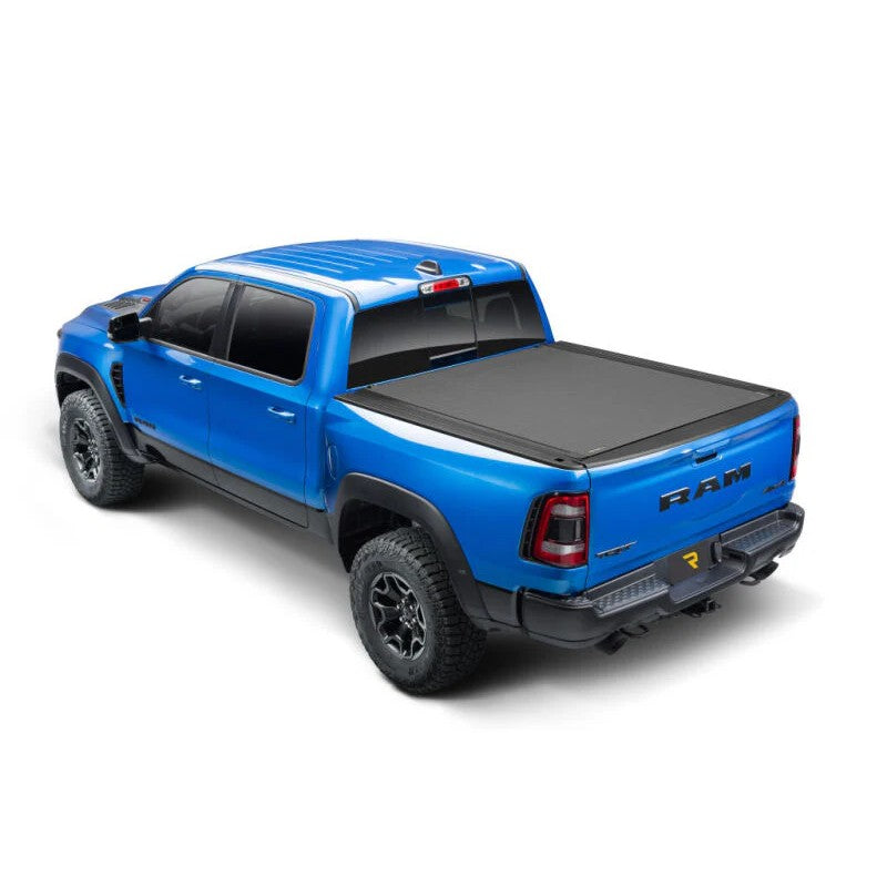 BAK Revolver X4s matte black hard roll-up tonneau cover installed on a Ram truck with an 8ft bed.