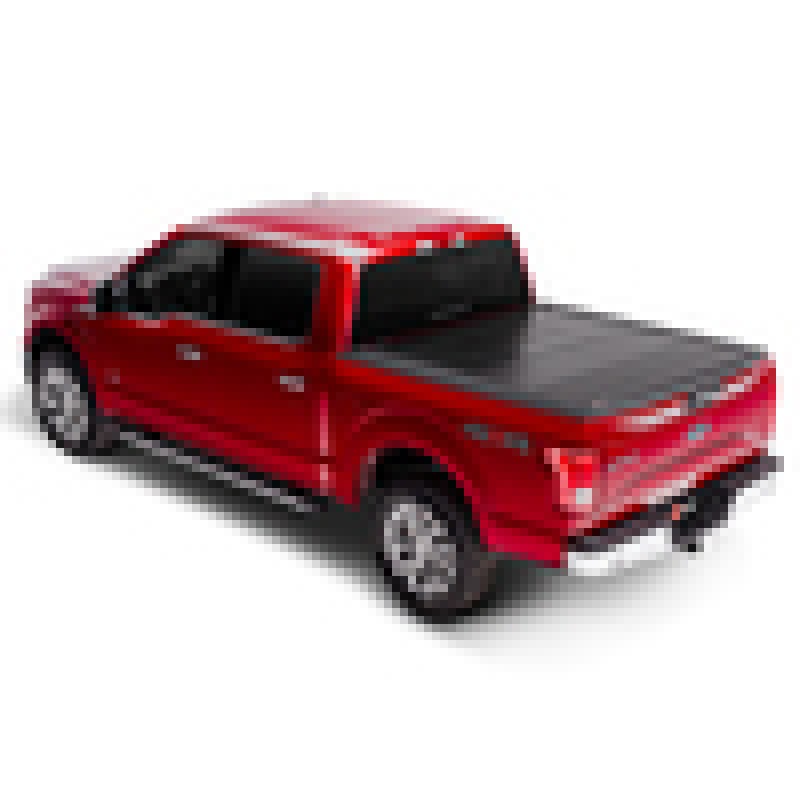 BAKFlip G2 black semi-gloss hard folding truck bed cover installed on a Ford Super Duty with an 8-foot bed.