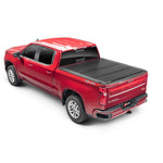 BAKFlip G2 semi-gloss black hard folding truck bed cover installed on a Chevrolet Silverado with a 6' 6" bed.