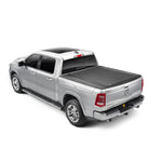 BAK Revolver X4s matte black hard roll-up tonneau cover installed on a Ram 1500 truck with RamBox management system.