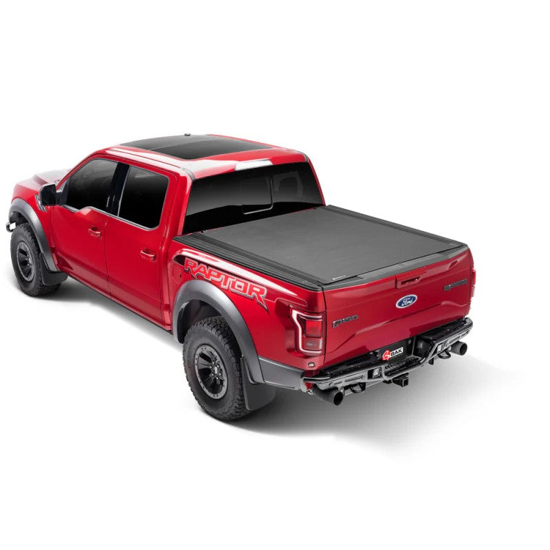 Matte black BAK Revolver X4s hard roll-up tonneau cover installed on a Jeep Gladiator 5ft bed