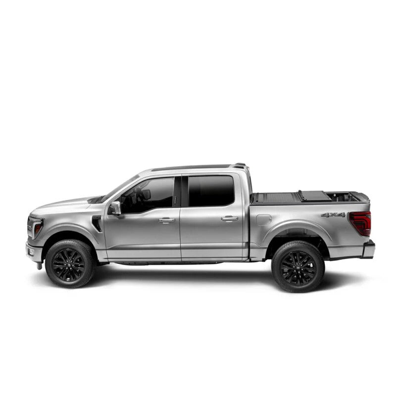 BAKFlip G2 hard folding aluminum truck bed cover in semi-gloss black on a 2021-2025 Ford F-150 with a 6.5ft bed.