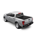 BAK BAKFlip G2 semi-gloss black aluminum hard folding truck bed cover installed on a 2022-2026 Nissan Frontier 5ft bed.