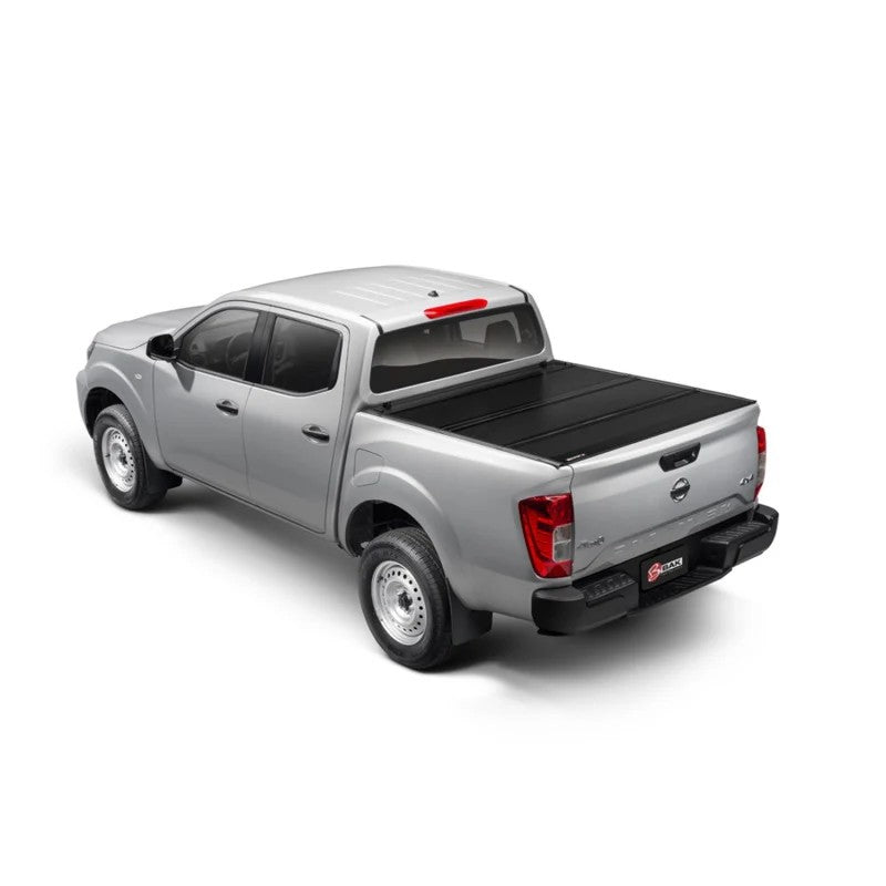 BAK BAKFlip G2 semi-gloss black aluminum hard folding truck bed cover installed on a 2022-2026 Nissan Frontier 5ft bed.