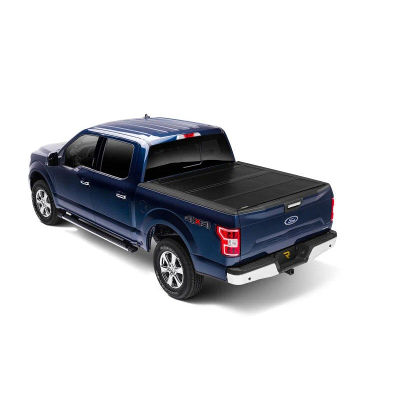 BAK BAKFlip FiberMax hard folding truck bed cover with FRP panels on a 2021-2025 Ford F-150 with a 5.7ft bed.