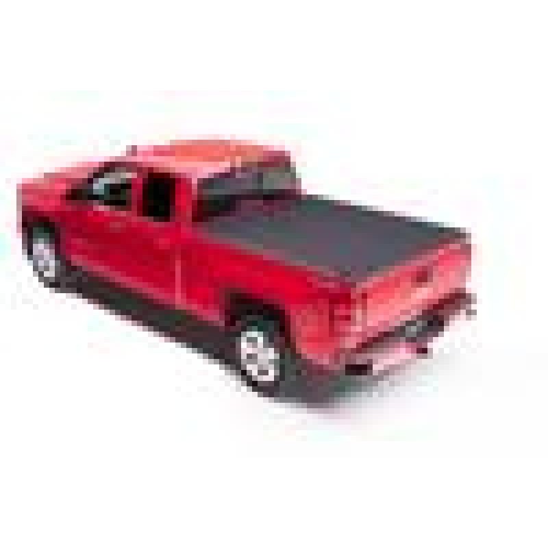 BAKFlip MX4 matte black textured hard folding truck bed cover installed flush on a pickup bed.