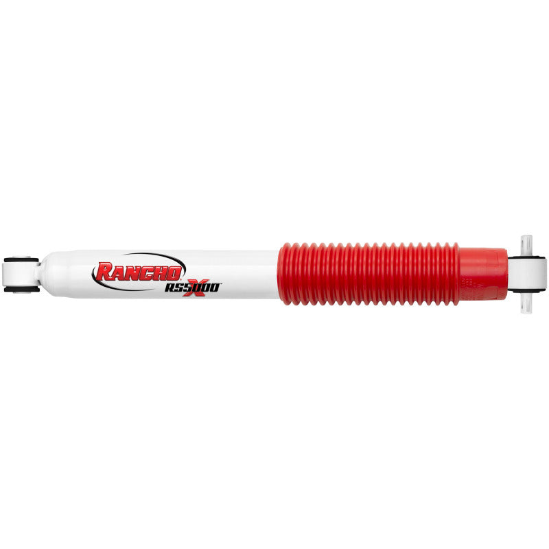 Rancho RS5000X white twin-tube rear shock absorber with red dust boot and mounting bushings.