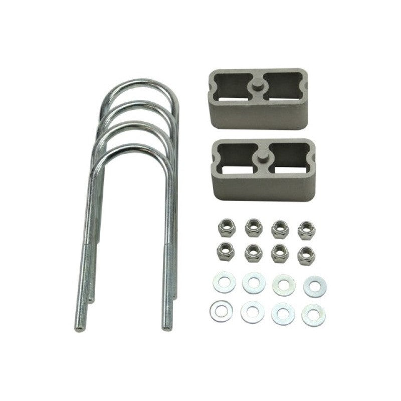 Belltech extruded aluminum 2-inch lowering blocks with angled taper and zinc-plated U-bolts.