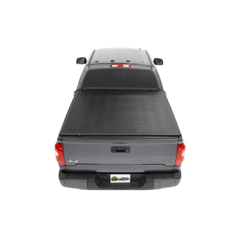 Bestop EZ-Fold black soft tri-fold tonneau cover mounted on a Toyota Tacoma 5-foot truck bed